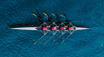 Women rowing on team